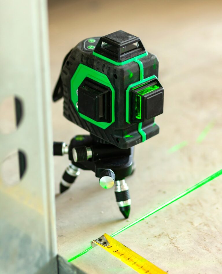 Laser level measuring tool in construction site.